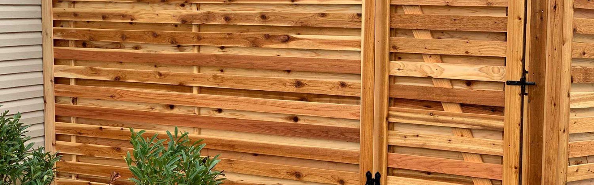 a horizontal fence with a beautifully applied stain